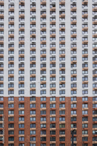 Modern architecture facade high rise multi storey residential building front view.