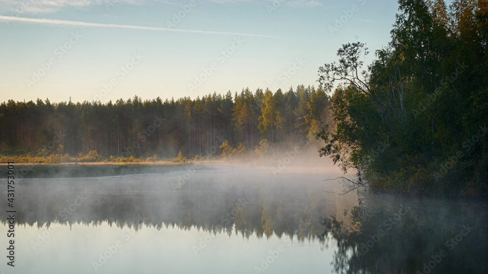 Dawn Lake Landscape. Fog over the water. Views of Russia