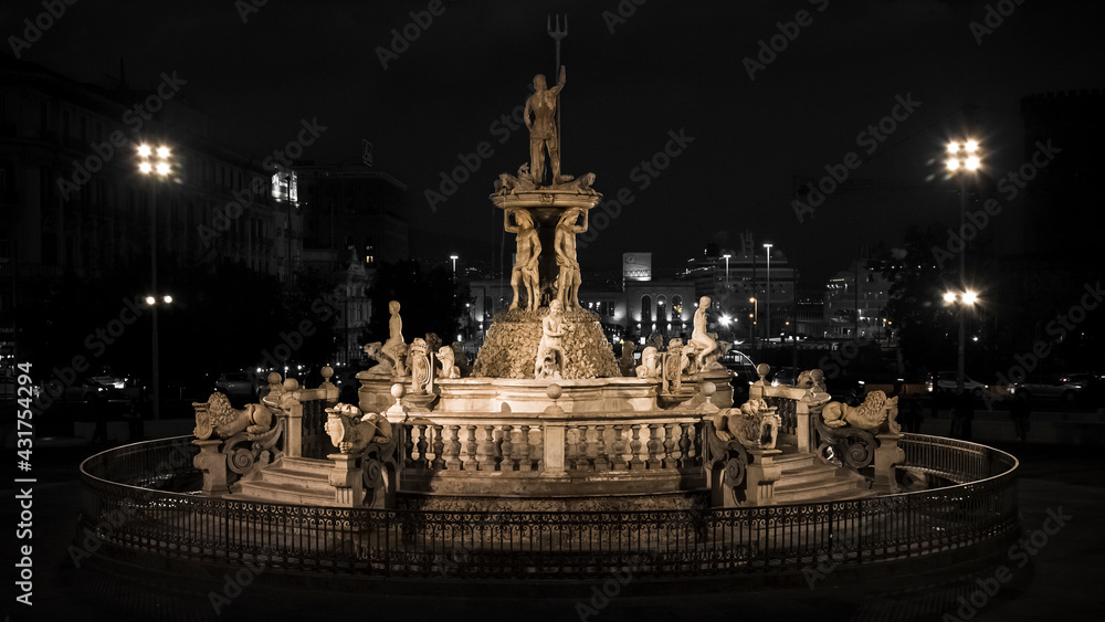 the triton fountain illuminates and enriches the splendid town hall square of Naples