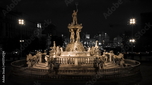 the triton fountain illuminates and enriches the splendid town hall square of Naples