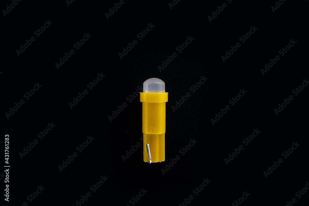 Car light bulb emitting diode, accessories and components for electronics vehicles. copy space. Black background close-up. 12V T5 Car light bulb emitting diode, accessories and components for electronics vehicles. copy space. Black background close-up. 12V T5