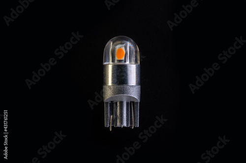 Car light bulb emitting diode, accessories and components for electronics vehicles. copy space. Black background close-up. 12V T10 photo