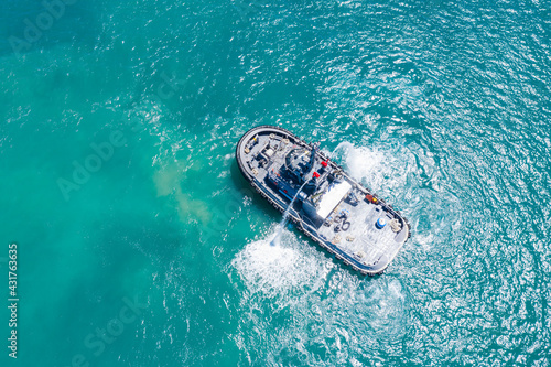 Aerial view of tug boat in the ocean, Thailand. photo