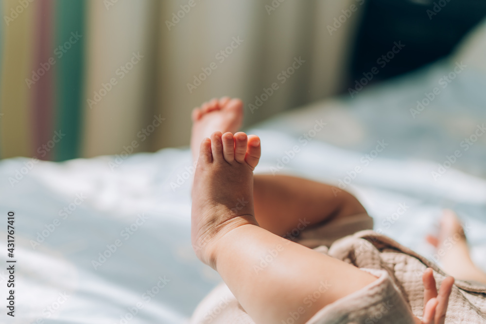 Child adoption and In Vitro Fertilization IVF . Asian child lying on the bed. Caring for newborn children Child adoption and In Vitro Fertilization IVF . Asian child lying on the bed. Caring for newborn children