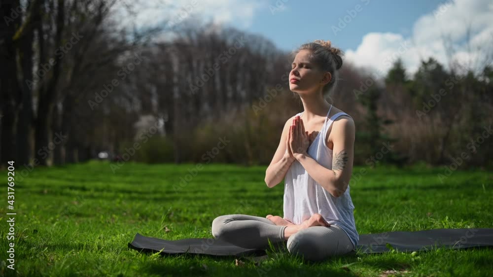 Yoga practice and meditation outdoor. Girl in the park Yoga practice and meditation outdoor. Girl in the park