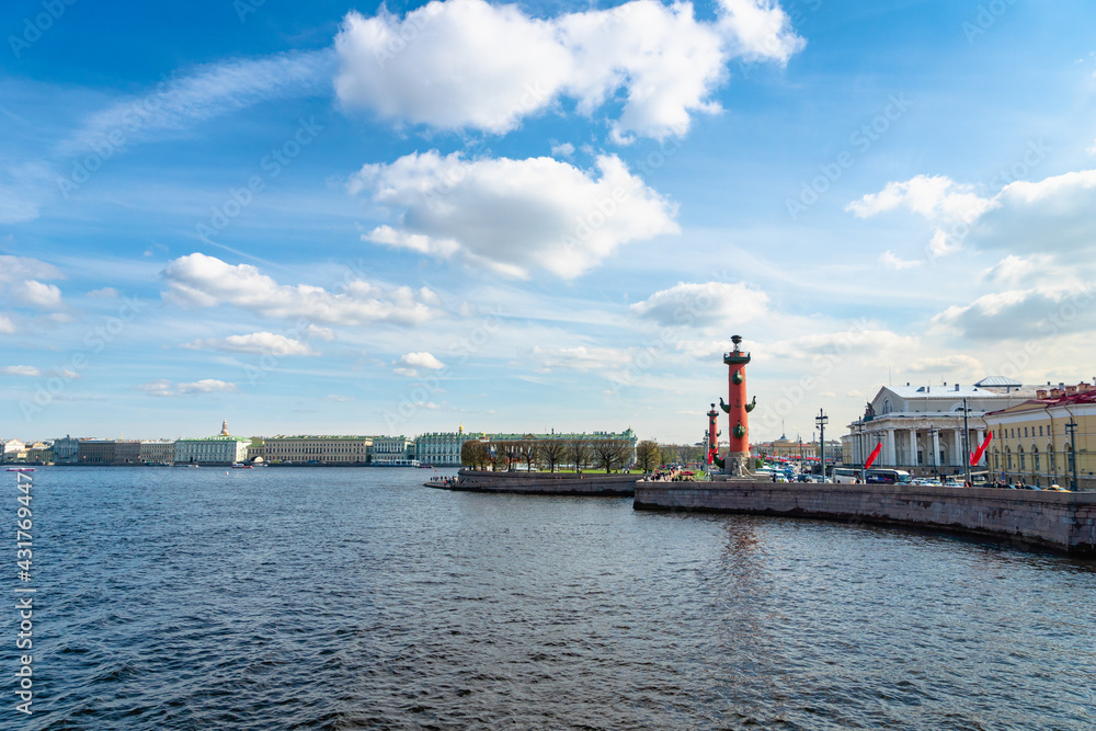 Saint Petersburg, Russia - May 2019:  Rostral column by Neva river in Saint Petersburg city center area.