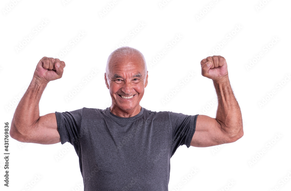 An elderly man, an athlete in excellent physical shape, celebrates a victory with cheerful emotions. On a white isolated background. An elderly man, an athlete in excellent physical shape, celebrates a victory with cheerful emotions. On a white isolated background.