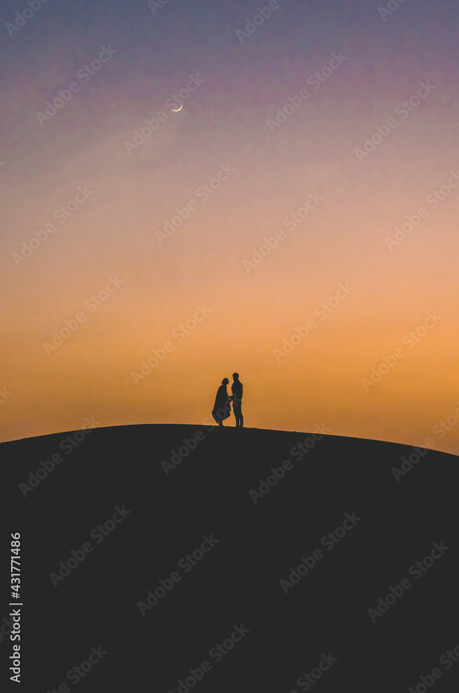 Silhouette of a couple, Thar Desert, Jaisalmer,  Rajasthan, India 