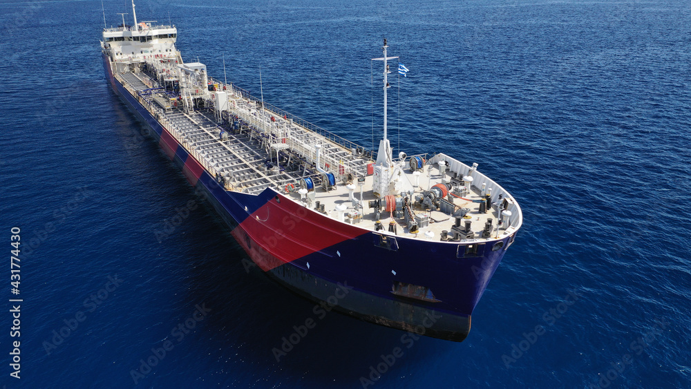 Naklejka premium Aerial drone photo of crude oil tanker carrier anchored in deep blue open ocean sea