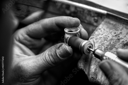 Goldsmith's hands at work, handmade jewelery