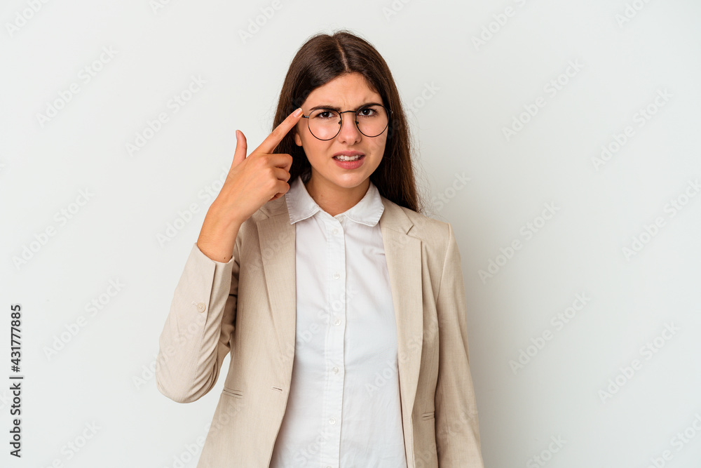 Young business caucasian woman isolated on white background showing a disappointment gesture with forefinger.