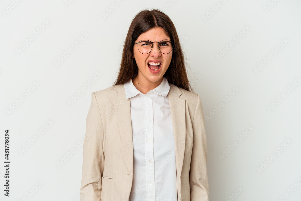 Young business caucasian woman isolated on white background screaming very angry and aggressive. Young business caucasian woman isolated on white background screaming very angry and aggressive.
