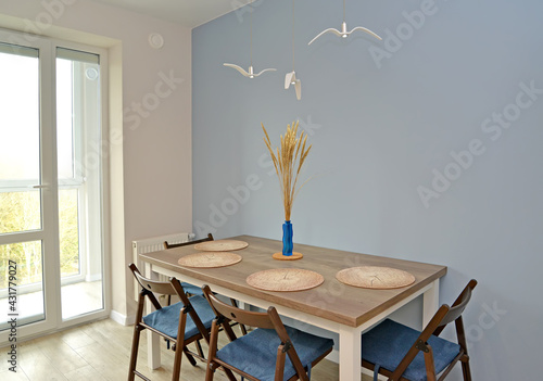 Fragment of the kitchen interior with access to the loggia. Ecominimalism photo