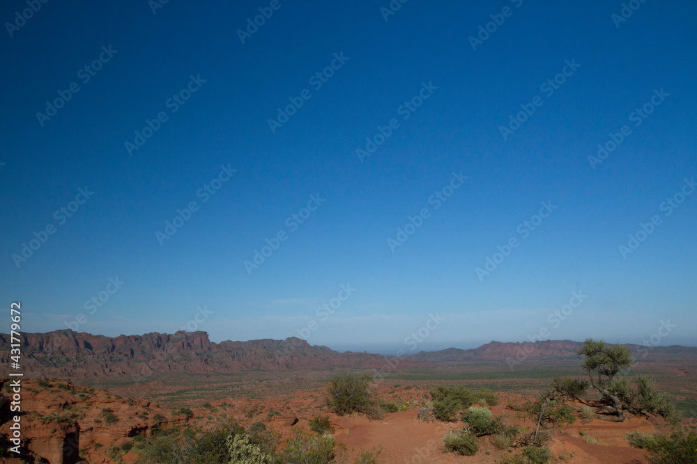 Beautiful emptiness. The arid desert, red sand and mountains under a deep blue sky. Beautiful emptiness. The arid desert, red sand and mountains under a deep blue sky.