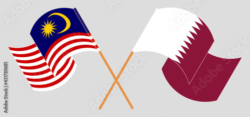 Photography Crossed and waving flags of Malaysia and Qatar
