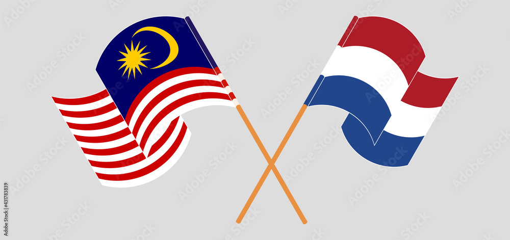 Crossed and waving flags of Malaysia and the Netherlands Crossed and waving flags of Malaysia and the Netherlands