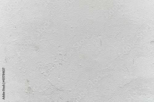 abstract background of an old shabby painted white wall close up