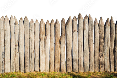 Wooden fence from logs isolated on white background. Fence from a stockade fence on white