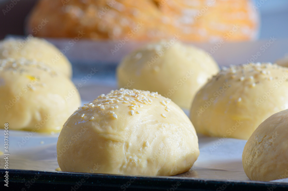 Fototapeta premium Home baking artisan brioche burger buns. Cooking bread.