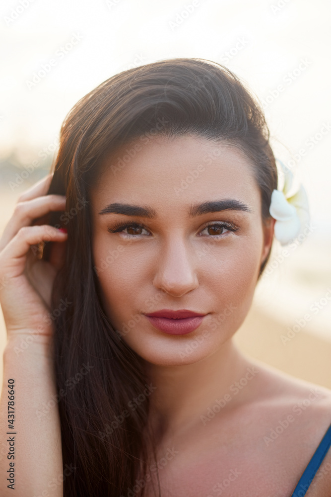 Beauty portrait of female face with natural skin on the sea. Beautiful woman on the beach. Skin care. Summer holidays, vacation, travel Beauty portrait of female face with natural skin on the sea. Beautiful woman on the beach. Skin care. Summer holidays, vacation, travel