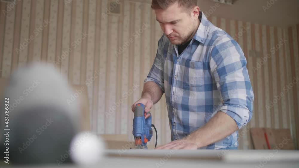 Carpenter uses a grinding machine to align Carpenter uses a grinding machine to align