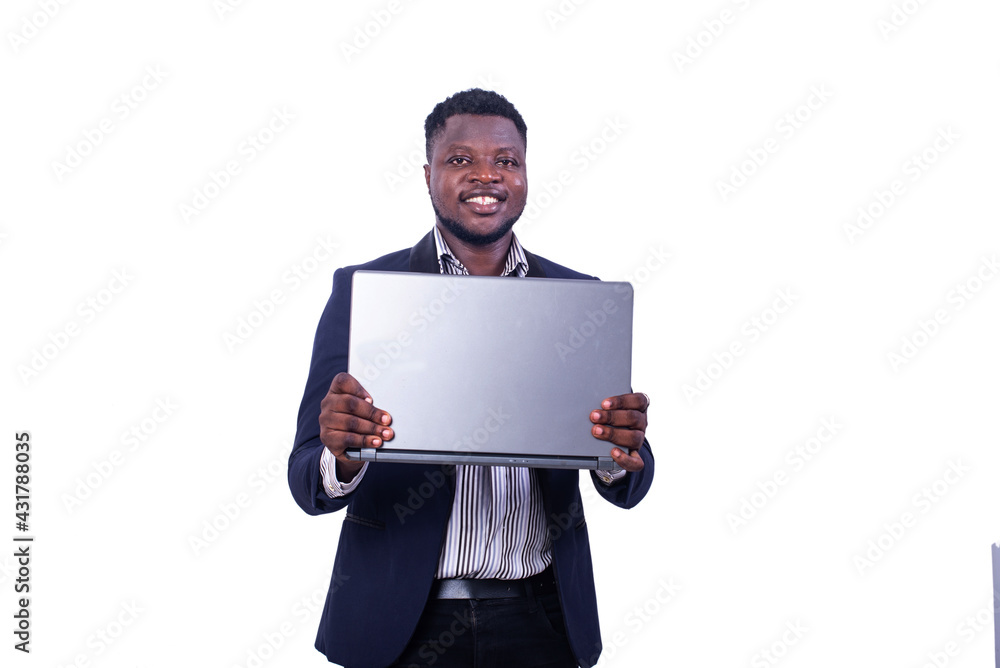 young businessman holding a laptop computer smiling. young businessman holding a laptop computer smiling.