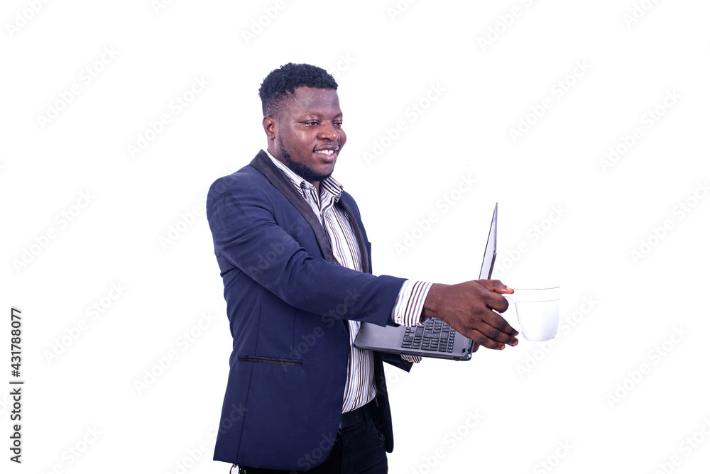 young businessman holding a laptop and taking a cup of coffee. young businessman holding a laptop and taking a cup of coffee.