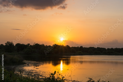 Yellow sunset over the lake in Pelican Park, Florida