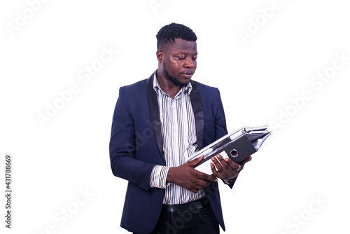 young serious businessman holding document in hand.