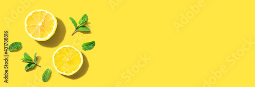 Fresh yellow lemons with mints overhead view