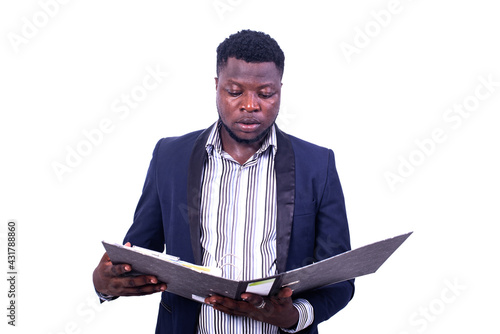 Wallpaper Mural young serious businessman reading documents in the filing cabinet. Torontodigital.ca