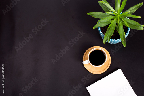 cup of coffee on office desk Top view with copy space, flat lay.