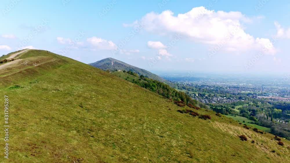 4K Aerial of Malvern Hills, flying above hills, panning motion over the top of the beautiful hills. people walking on the path to the peak 4K Aerial of Malvern Hills, flying above hills, panning motion over the top of the beautiful hills. people walking on the path to the peak