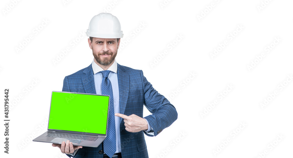 man in suit and safety helmet pointing finger on green screen of computer copy space, advertisement. man in suit and safety helmet pointing finger on green screen of computer copy space, advertisement.