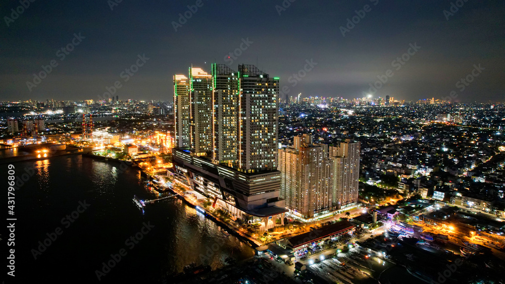 Fototapeta premium Jakarta, Indonesia, May 5, 2021 : Aerial view of Beautiful sunset view to night Jakarta