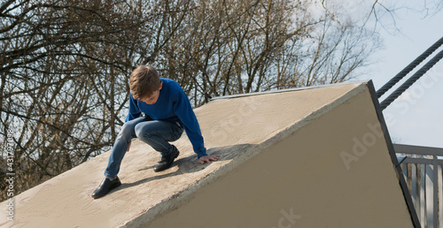 A little boy walks in the park on a sunny day