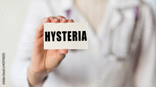 HYSTERIA. Card with text in hand of Medical Doctor.