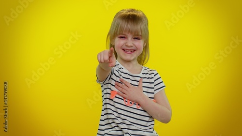Blonde teen kid child girl laughing out loud after hearing ridiculous anecdote, funny joke, feeling carefree amused, positive people, isolated on yellow background. Young children lifestyle emotions