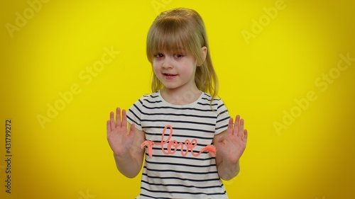 I do not need it, not me, no thanks. Honest little cute blonde kid child pointing fingers himself ask say who me, not guilty. Yellow studio wall background. Teenager children girl lifestyle emotions