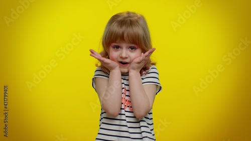 How could you. Frustrated child kid girl raising hands in indignant expression, demonstrating disbelief irritation by troubles. Yellow background. Young children asking why, what reason of failure