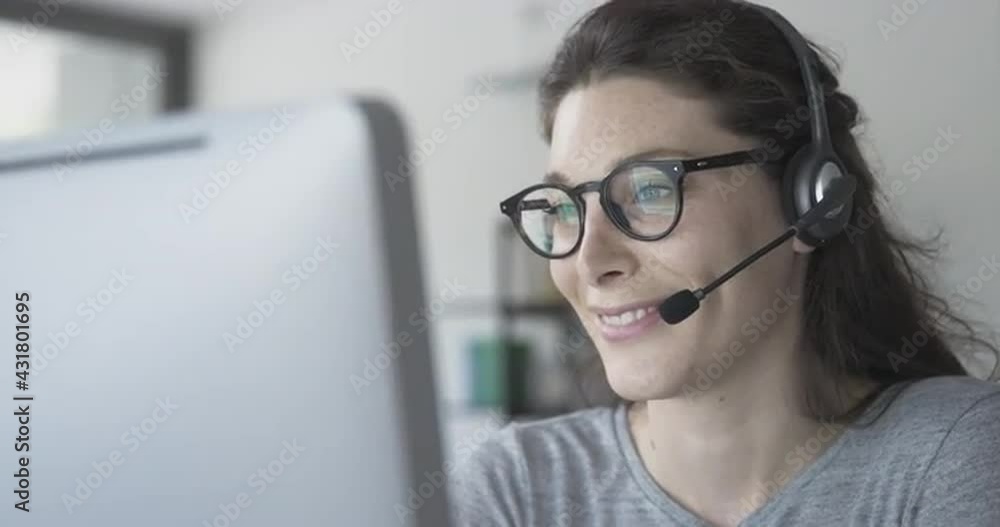 Woman video calling customers online Woman video calling customers online