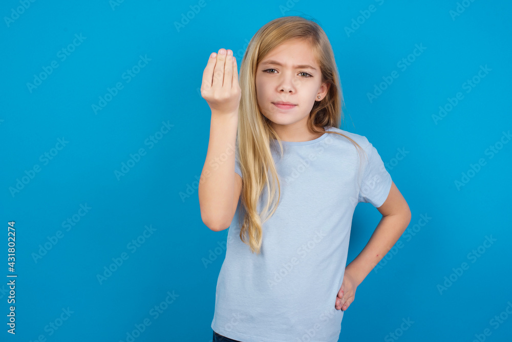 Fototapeta premium What the hell are you talking about. Shot of frustrated beautiful Caucasian little girl gesturing with raised hand doing Italian gesture, frowning, being displeased and confused with dumb question.