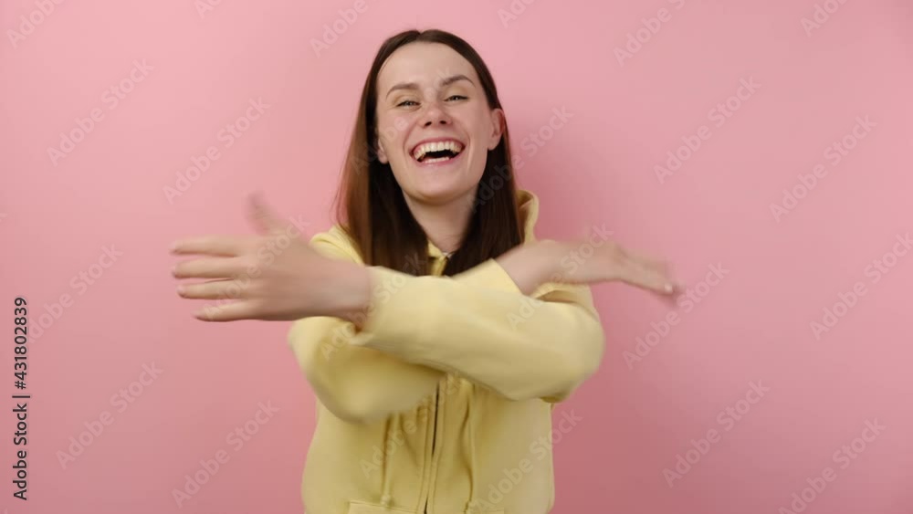 Positive attractive happy caucasian woman calling with hands, wanting to hug, glad to see, congratulating, posing isolated over pink color background. Come here into my hugs. People emotion concept Positive attractive happy caucasian woman calling with hands, wanting to hug, glad to see, congratulating, posing isolated over pink color background. Come here into my hugs. People emotion concept