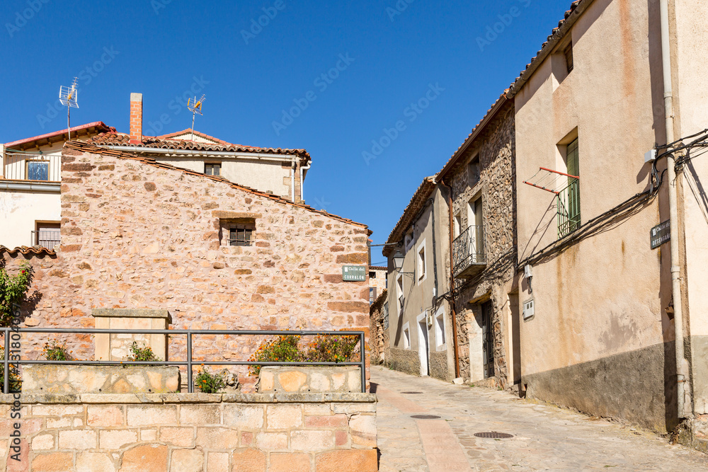 a street with traditional houses in Anguita town, province of Guadalajara, Castile La Mancha, Spain