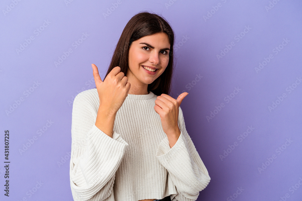 Young caucasian woman isolated on purple background raising both thumbs up, smiling and confident. Young caucasian woman isolated on purple background raising both thumbs up, smiling and confident.