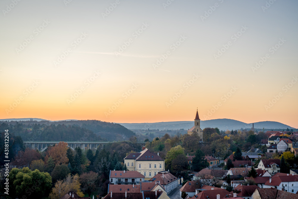 Obraz premium The Veszprém viaduct and the Church of Saint Laszlo at sunset