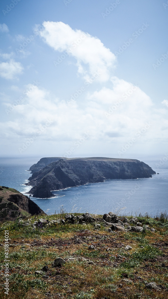 Porto Santo is a Portuguese island 43 kilometres northeast of Madeira Island in the North Atlantic Ocean. Porto Santo is a Portuguese island 43 kilometres northeast of Madeira Island in the North Atlantic Ocean.
