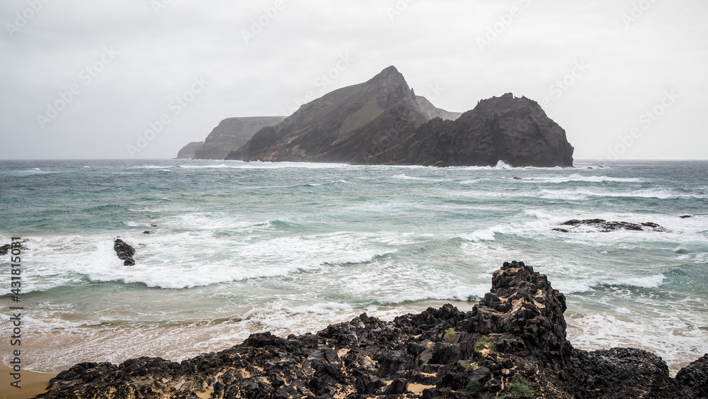 Porto Santo is a Portuguese island 43 kilometres northeast of Madeira Island in the North Atlantic Ocean. Porto Santo is a Portuguese island 43 kilometres northeast of Madeira Island in the North Atlantic Ocean.