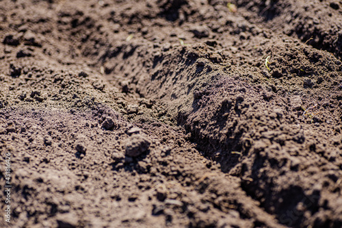 spring time in Ukrainian village. Prepare soil for planting.