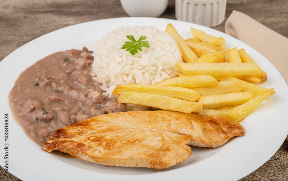 Beef, rice, beans and french fries. Typical brazilian executive dish Beef, rice, beans and french fries. Typical brazilian executive dish